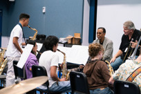A student saxophonist plays for Stanley Clarke